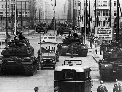 American and Soviet tanks facing each other across the dividing line in Berlin, 1961. From the U.S. Army Archives.